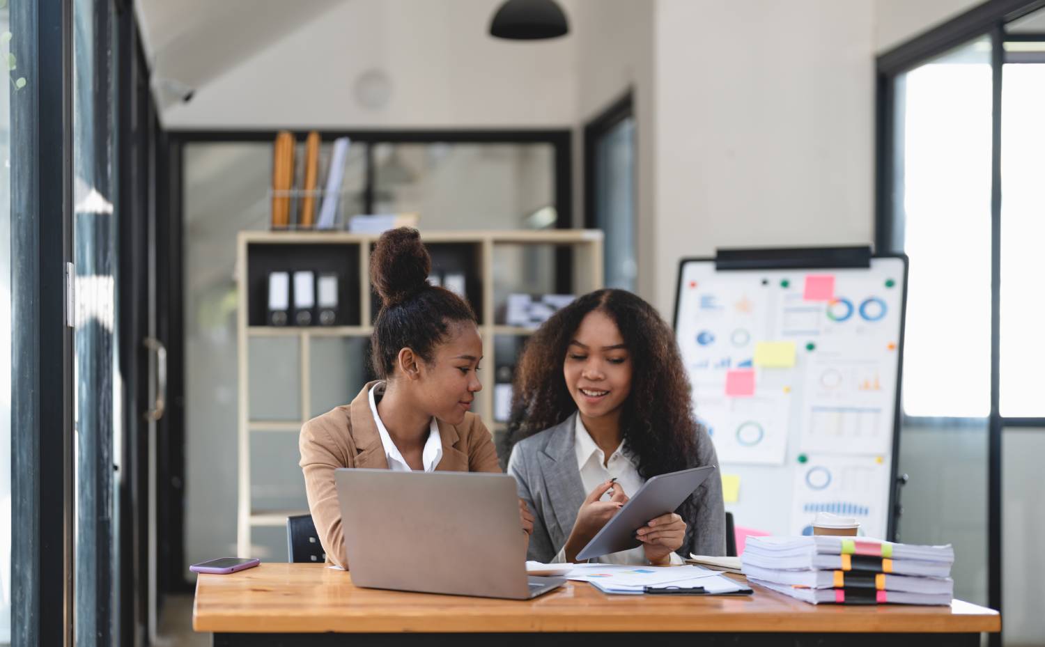 two-young-business-people-working-together-in-offi-2022-10-21-20-52-36-utc (1)