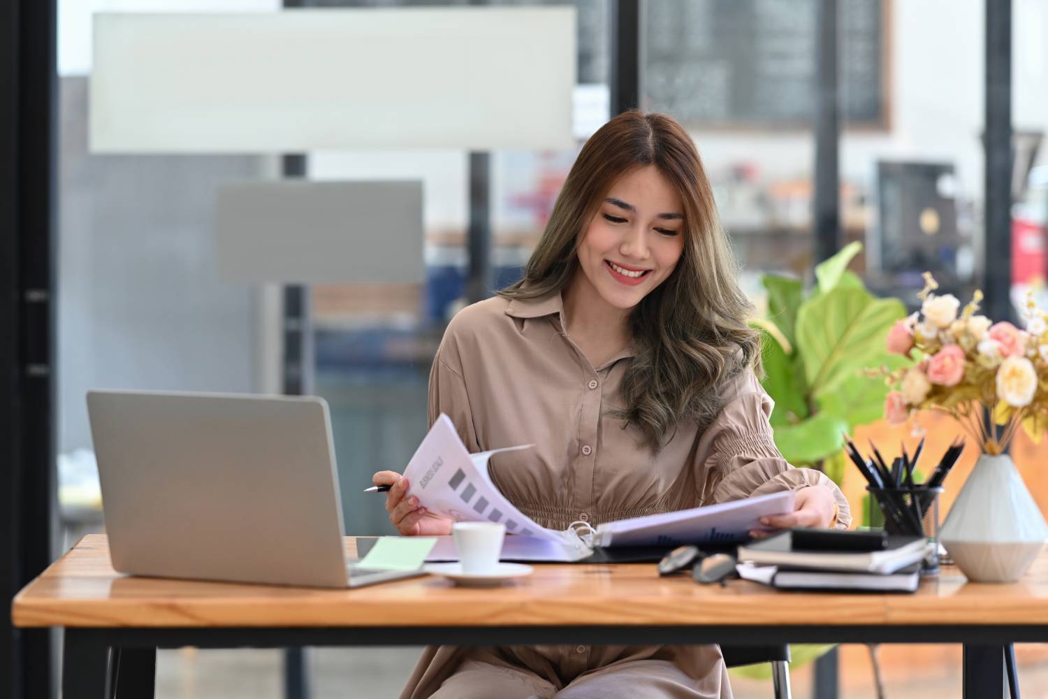 female-economist-working-with-accounting-documents-2022-03-18-09-11-26-utc (1)