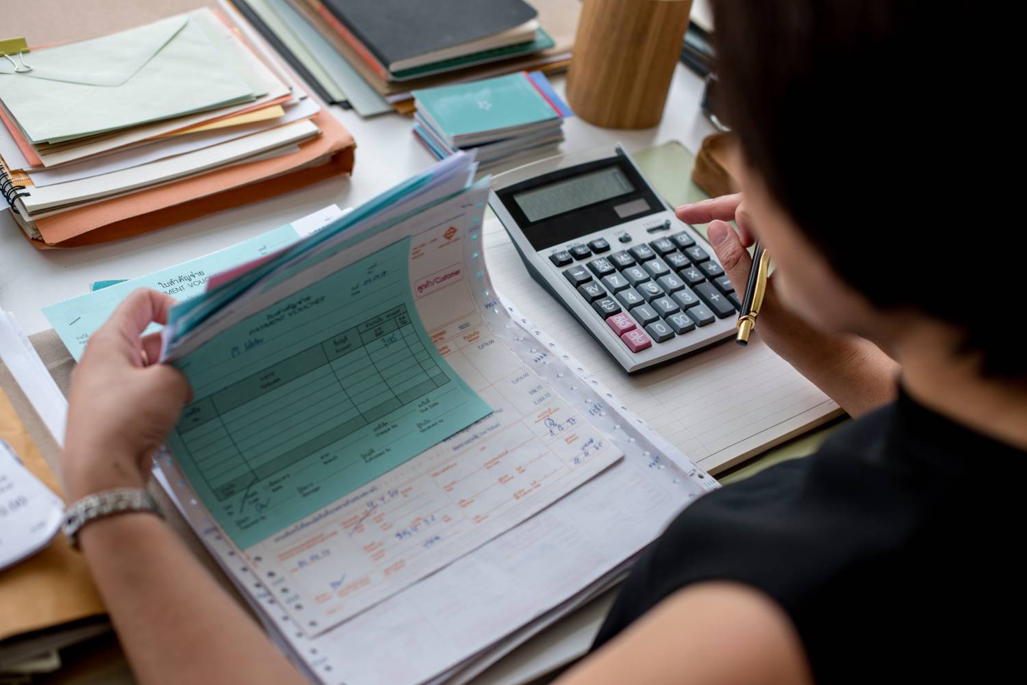 adult-asian-woman-working-on-payment-bills-account-2022-09-16-09-07-24-utc (1)